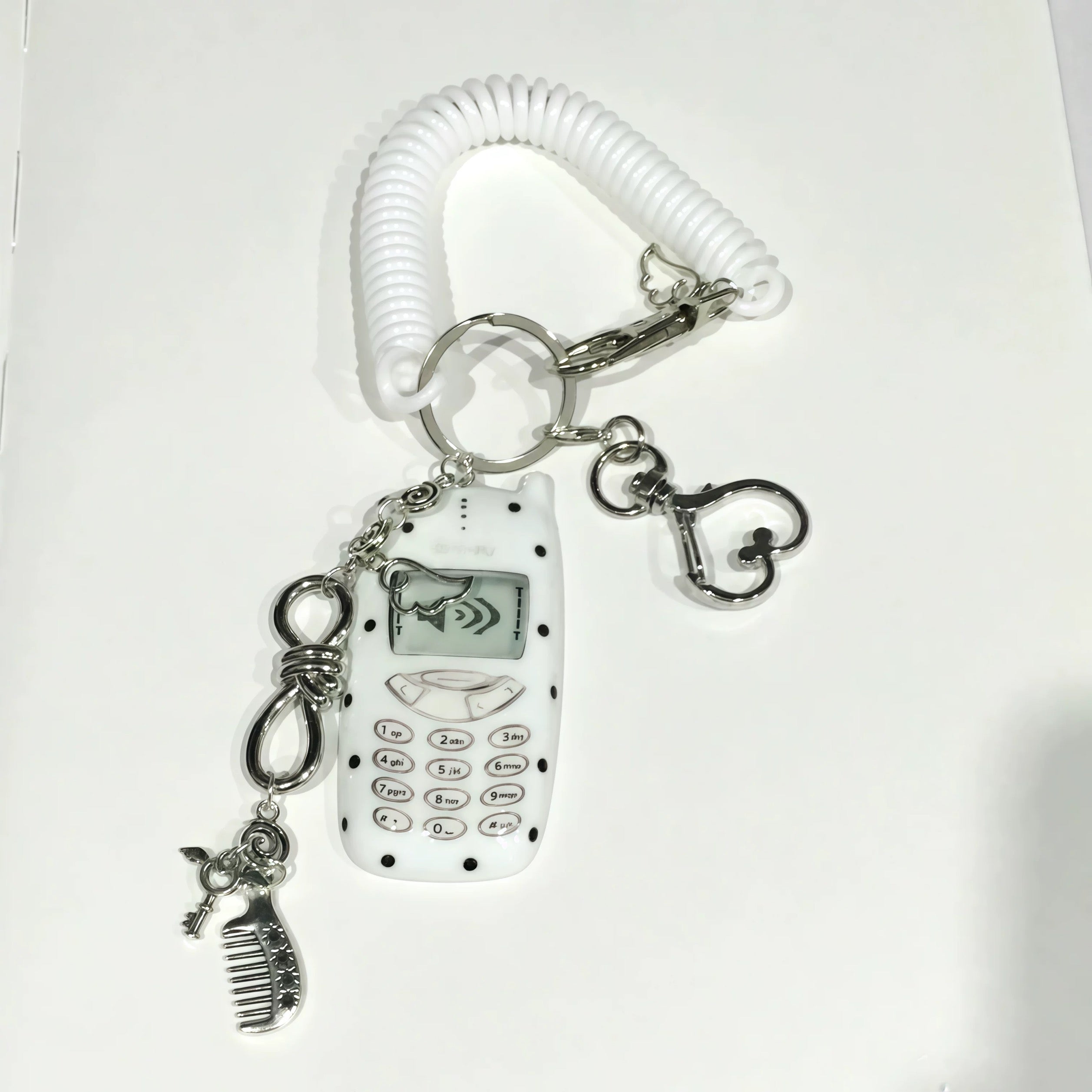 Mobile phone-shaped charm